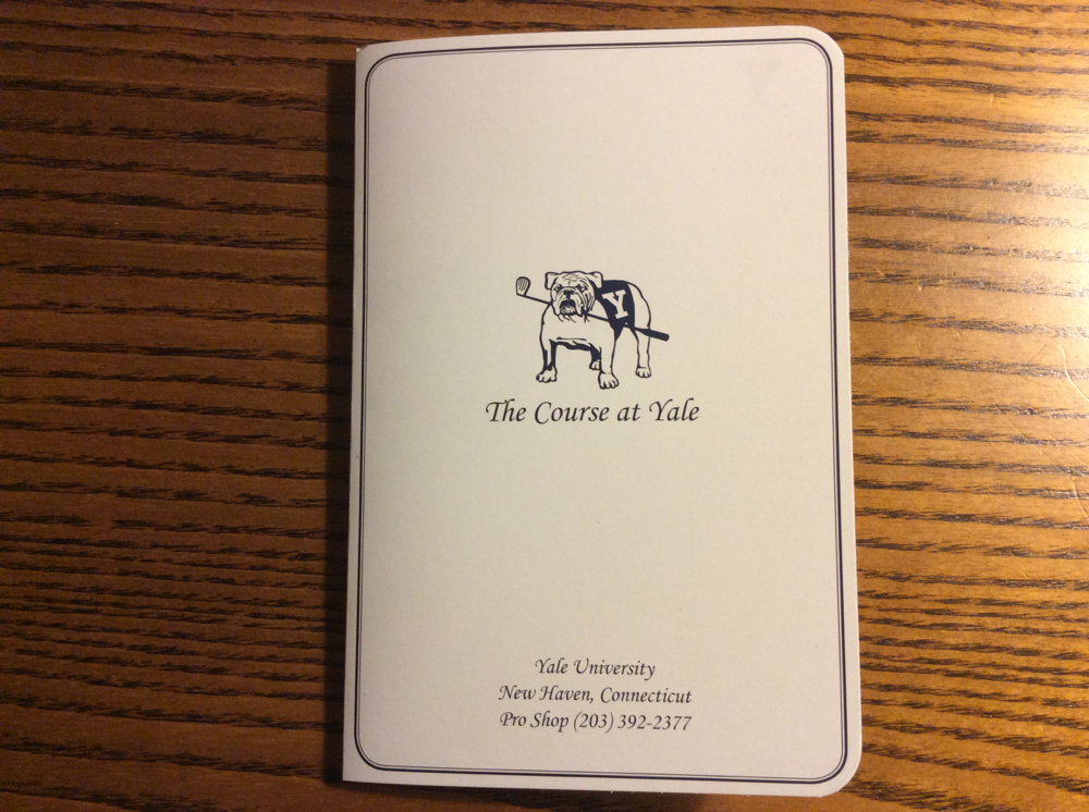 The scorecard of The Course at Yale, featuring the Yale Bulldog's mascot, Handsome Dan