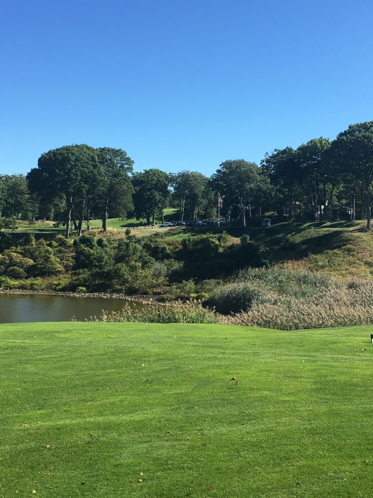 The view of the first tee box and its precipitous drop, from the fairway
