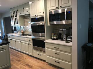  Kitchen Cabinets, Raised panel, Painted - 2 colors, Medium rub finish, Solid Walnut top on Island.