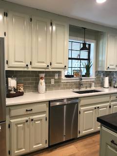  Kitchen Cabinets, Raised panel, Painted - 2 colors, Medium rub finish, Solid Walnut top on Island.