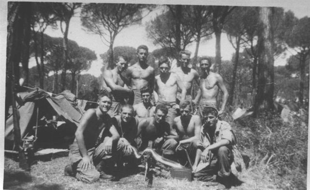 "D" Company preparing the bundles, August 14th , 1944, Italy