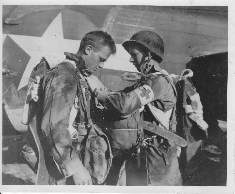 Checking parachutes, Doc LECKLIDER on the right