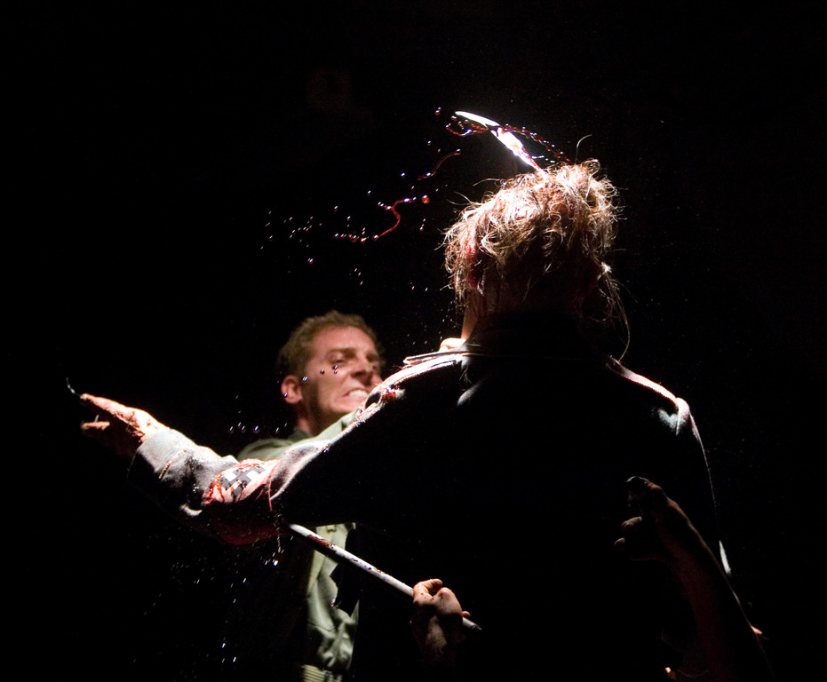 Kevin Zaidemann plants an axe in the fake creature head that we shot in slo-mo.  Blood sprays everywhere!