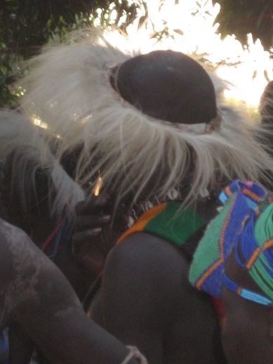 the men wear headgear from the Kalabas monkey
