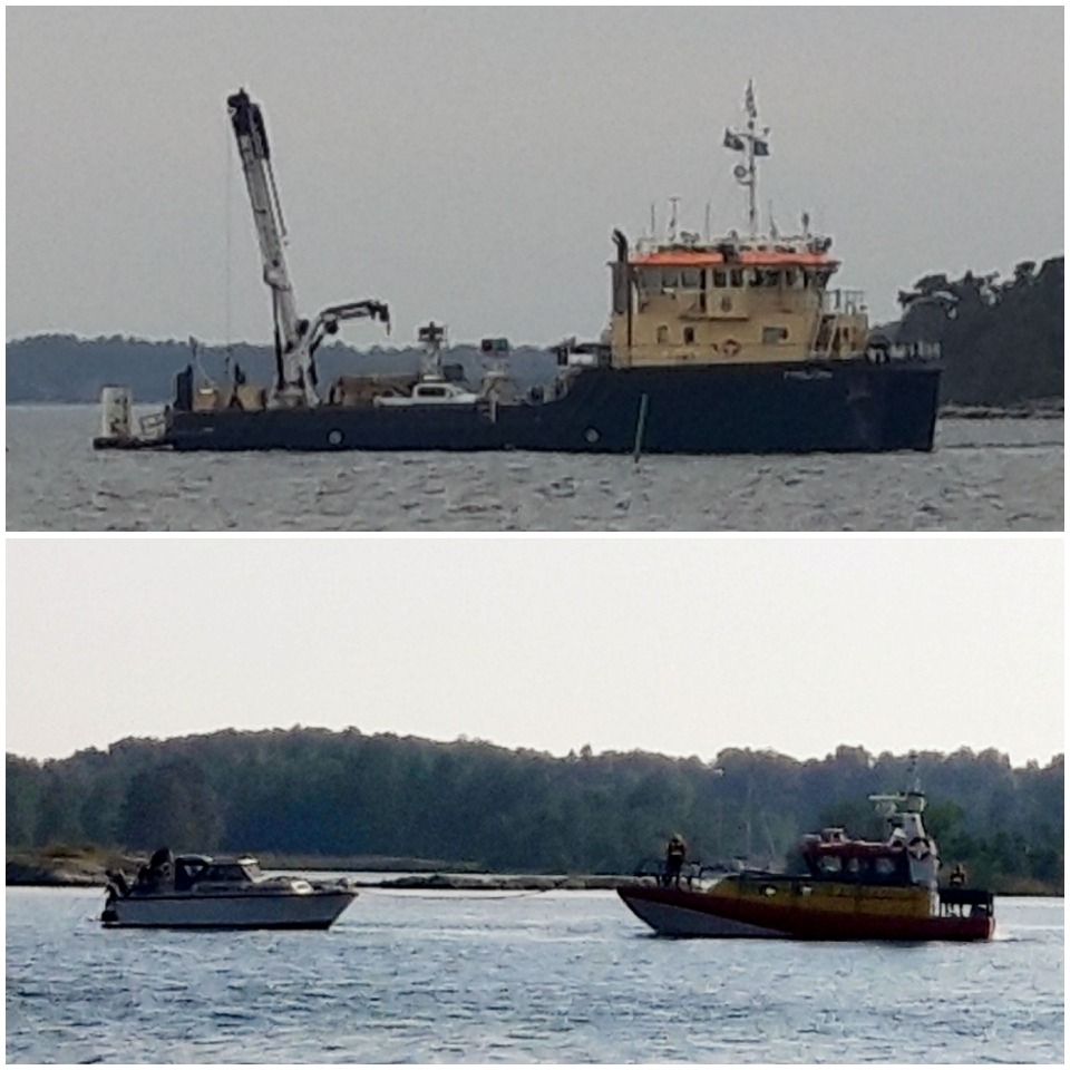 Tonnenleger am Leuchtfeuer und Seenotrettung in Aktion beim Nachbarboot.