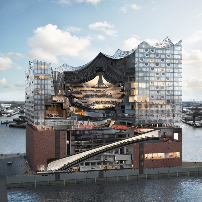 The red-brick base, which was previously a warehouse for cocoa, contains various facilities, including a garage and a music education center, while the upper glass volume comprises luxury apartments and a hotel and spa, in addition to the new music venues