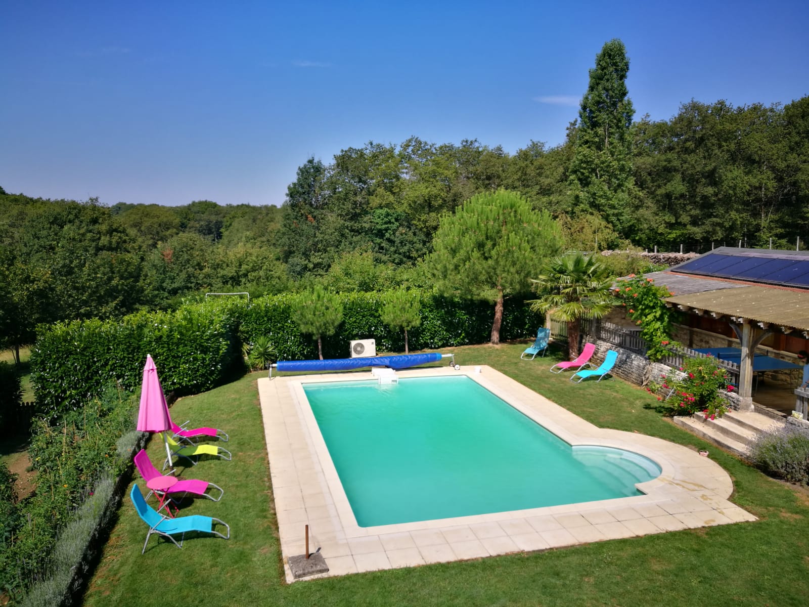  the flowery pool area with the vegetable garden