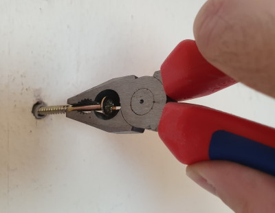 Remove dowel with pliers and screw