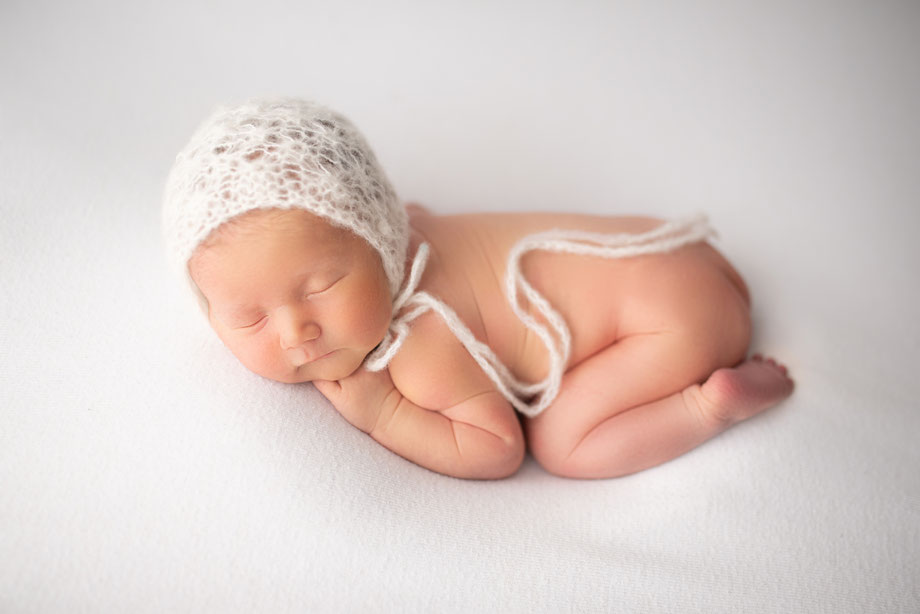 newborn shoot with cap