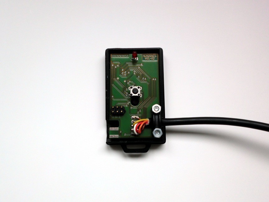 PCB with assembled cable in lower case of enclosure