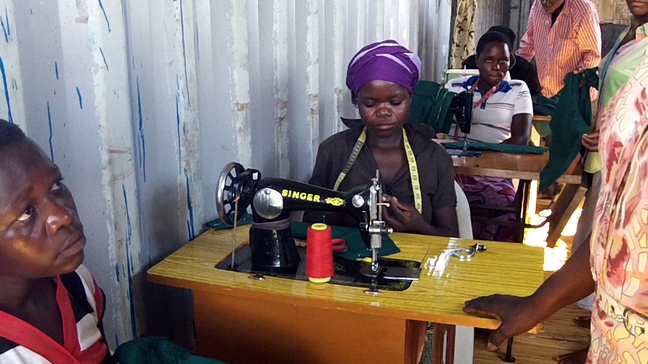 a student winding thread on the bobbin