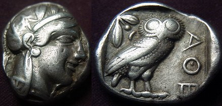 Attica, Athens AR Tetradrachm. 465-460 BC. Head of Athena right in crested helmet / Owl standing right, head facing, olive spring and crescent to left.