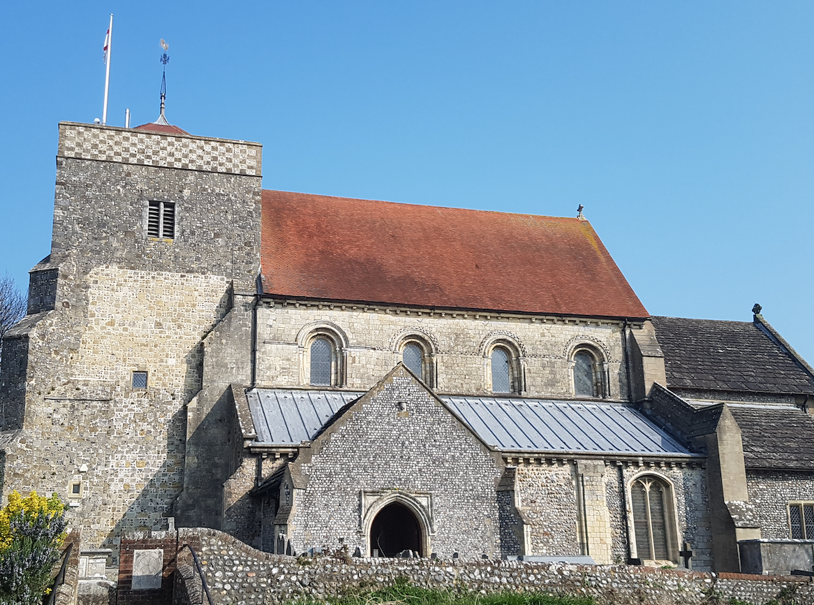 St Andrew, a Norman church with a 16th cent. tower.