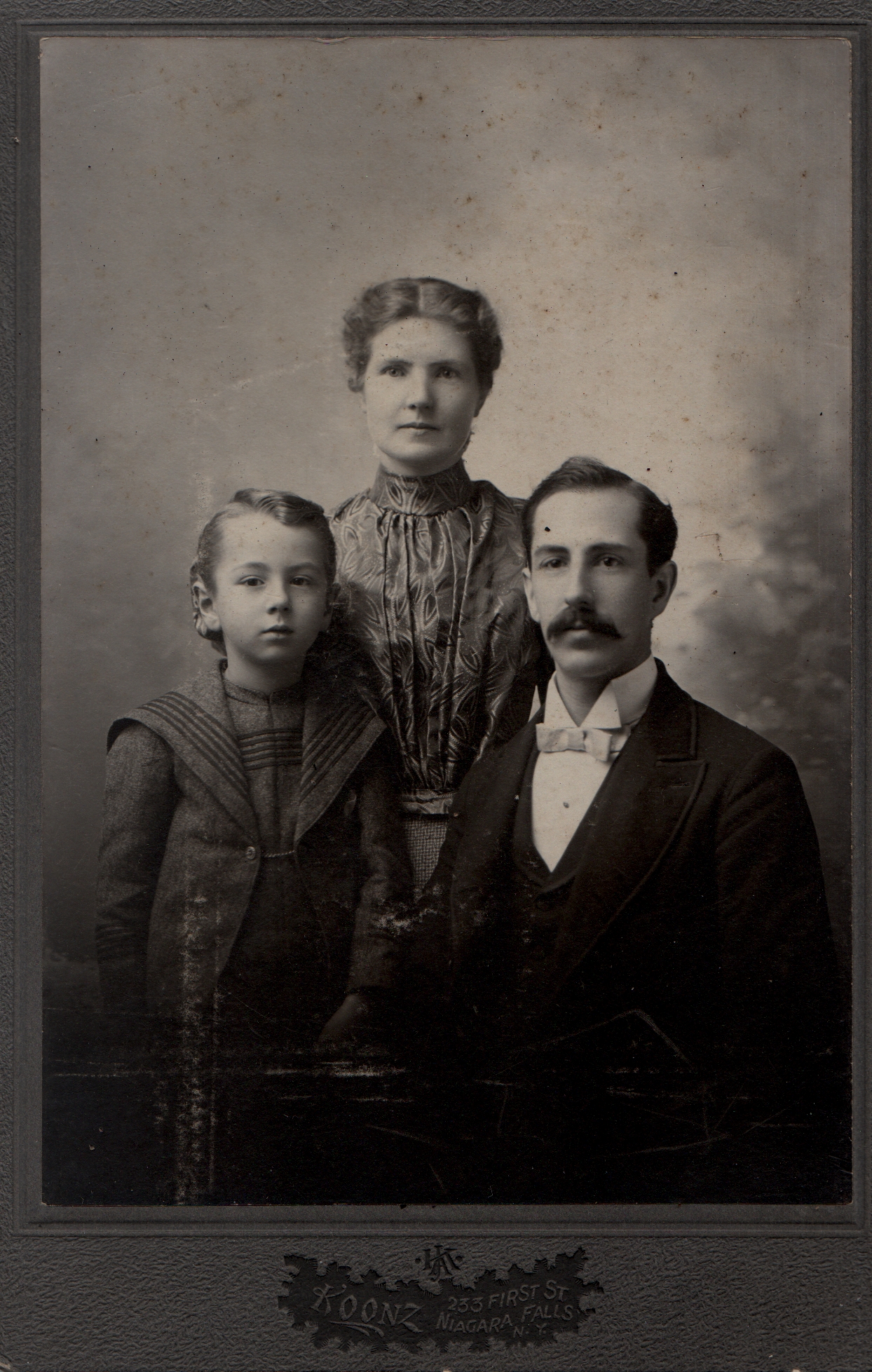 Alberta Hodson, her husband Herbert Frederick Polhill and son. circa 1898. Reverse ' for Gus with love.'