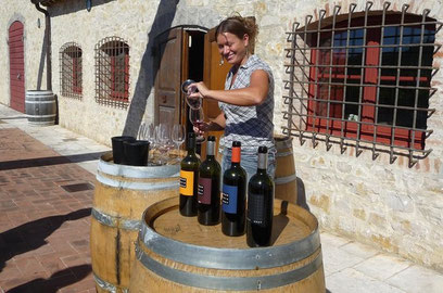 Smiling woman pouring wine