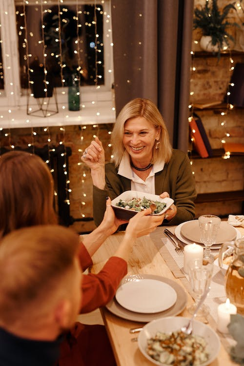 A person receiving a bowl of food