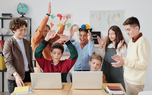 Students interacting with their teacher