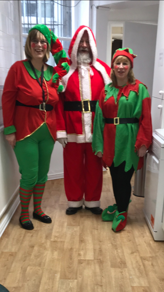 Father Christmas with two of his elves