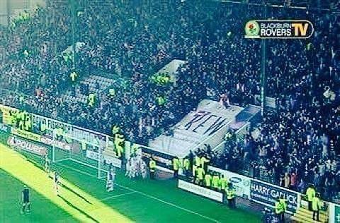 Rovers fans celebrate with players at Turf Moor.