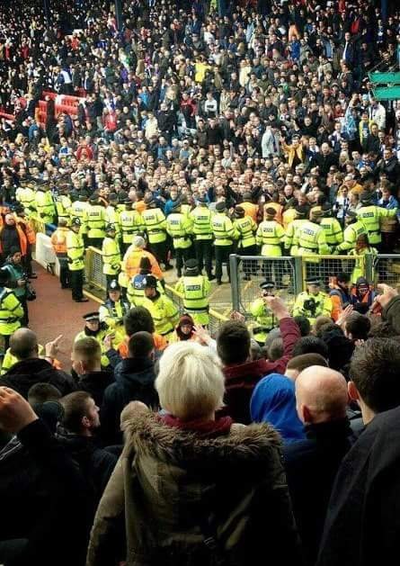 Sunday, 17th March 2013. Championship, Rovers 1 - 1 Burnley.  Rovers fans attempt to reach Burnley fans as they fear the end of an unbeaten 34 year run  at Ewood Park before David Dunn's (off-side, haha) equaliser in the 6th minute of added time.