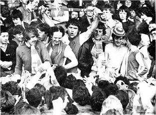 Rovers players and fans enjoy their promotion from Division 3 in 1980 at Bury.