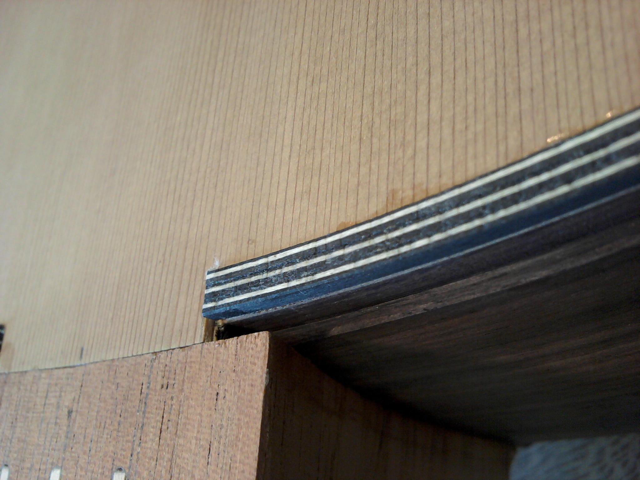 View of the table binding and the groove for the next binding on the side of the ribs.