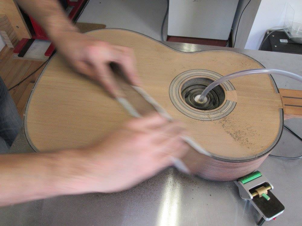 Pressure sanding of a guitar soundboard