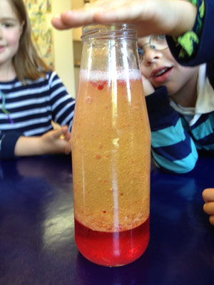 Young scientists exploring colourful reactions at Custom Kids Science Club.