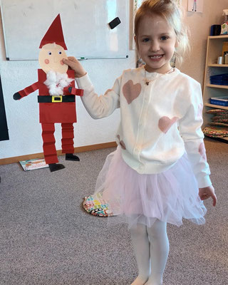 Child enjoying imaginative play during a themed English learning activity at Custom Kids.