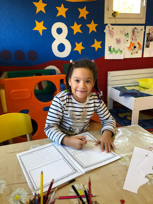Children love writing in their journals at Custom Kids.
