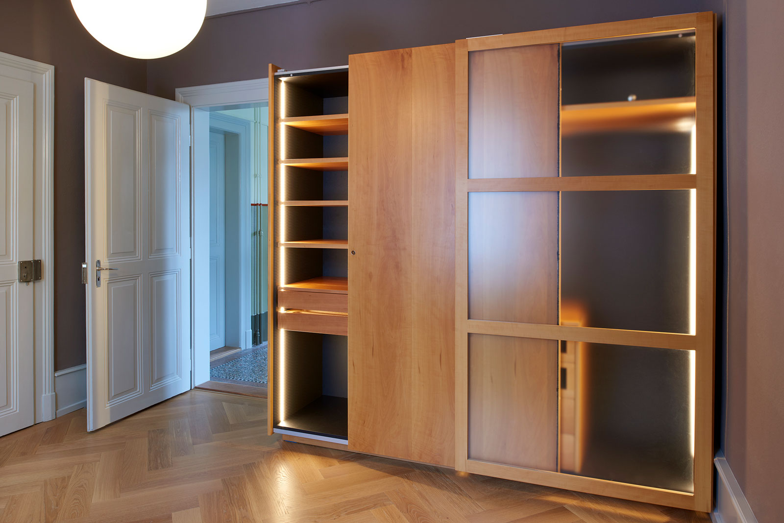 Sliding door cabinet with pear tree; Design carpenter, photo Alain Bucher