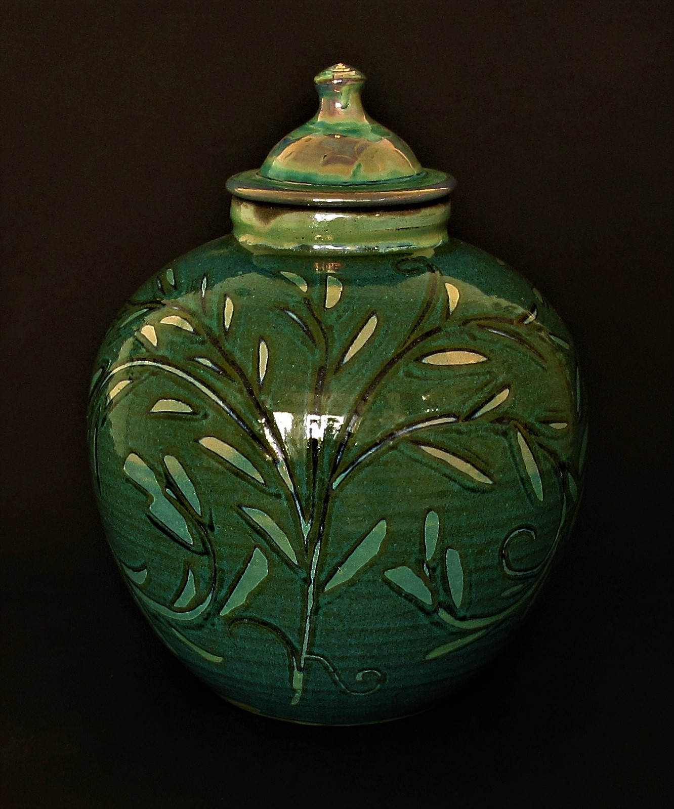 Large Globe Lidded Jar. Olive green with lustre. £120.