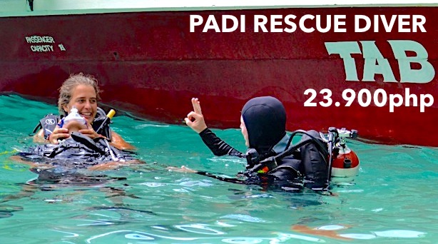 3 scuba diver at the surface doing rescue skills while in a padi course in el nido, palawan