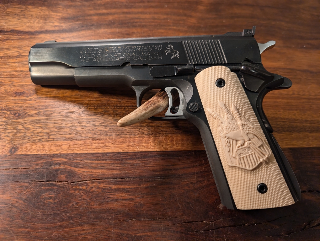 Colt 1911 with carved grips 
