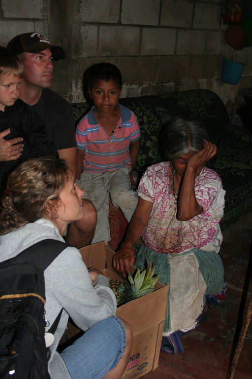 giving a food basket to an older lady