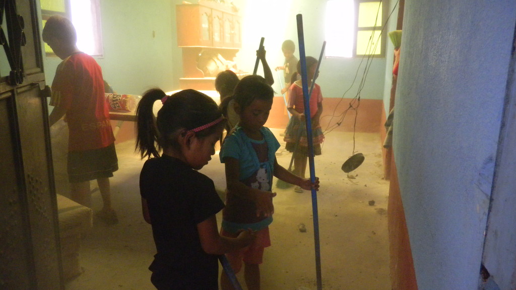 kids cleaning esbin's house after replacing the roof