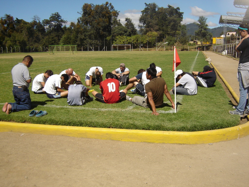 leadership team praying before getting started