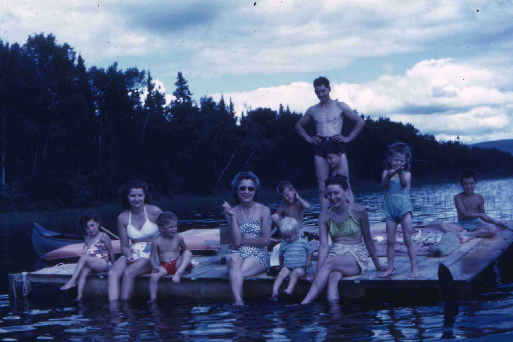 1946 with members of the Cook, Baggen and Clasby families.  Our mom is on the far left in the white swimming suit.  The younger lake generation will find it hard to believe there was no electricity and no phone service back then.  Electricity did not come