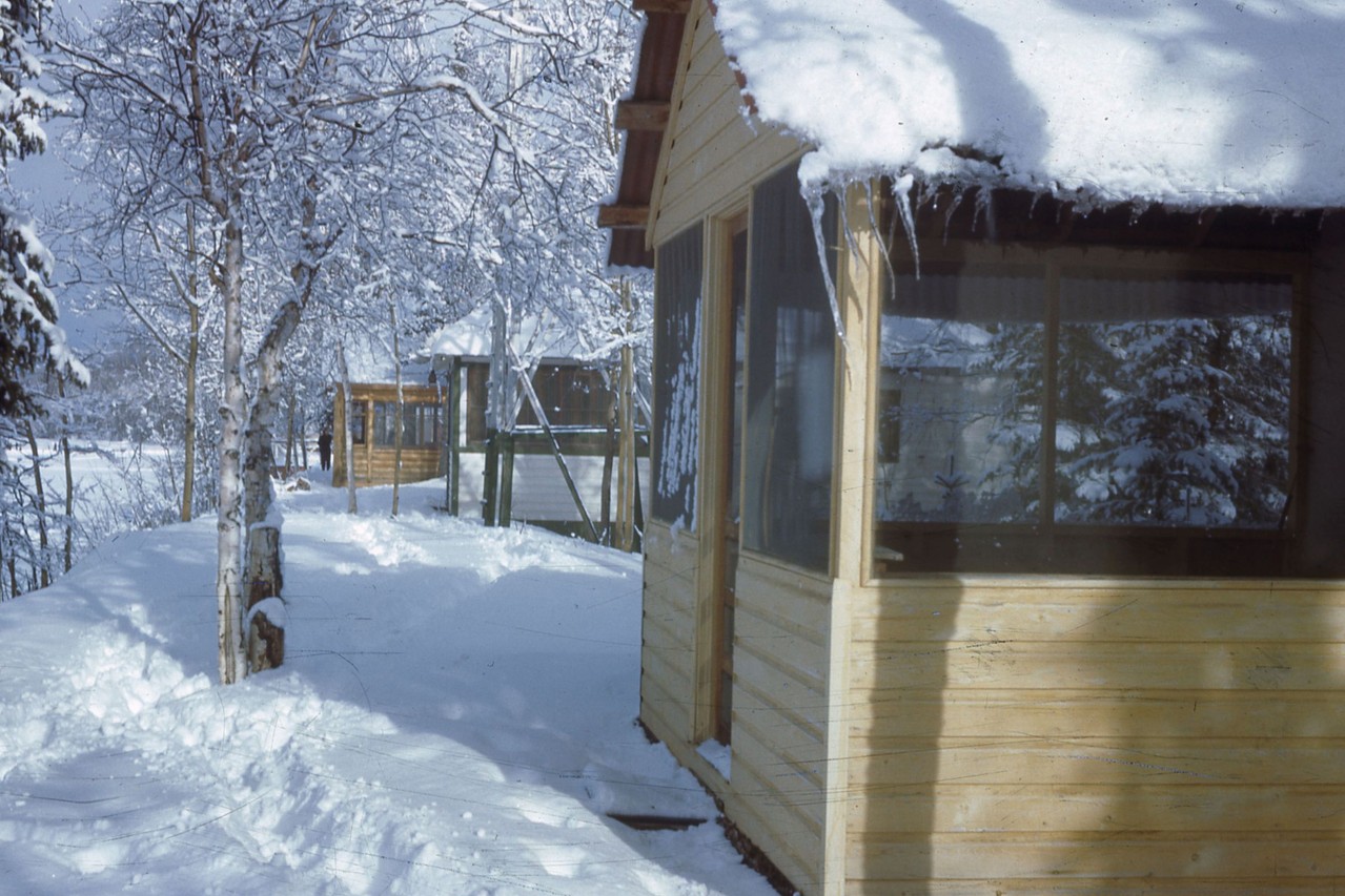 Winter at Harding Lake.  Stepovich cabin at far end of photo with person in front.  Probably 1940's.