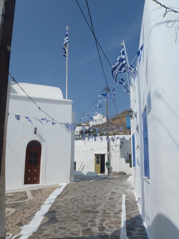 Plaka, Milos, Cyclades, Greece. flags