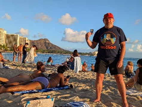 PSC Biz Card was sun tanning on the beach in Waikiki with Julian F 