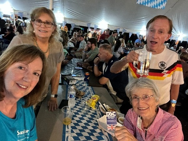 PSC Business Card hoisted at Woodridge Octoberfest with Pauline M, Nancy G, Terry T and Karl S