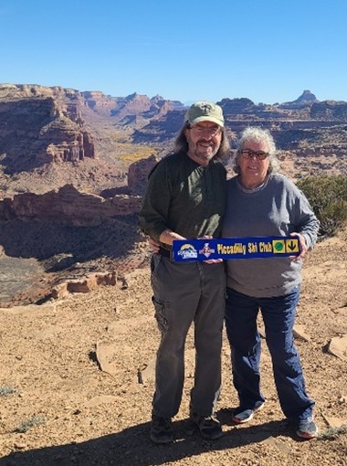 Debbie and Keith F with a PSC trail sign at Central Utah’s San Rafael River 