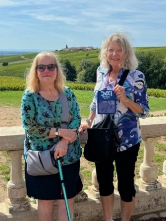 PSC Neck Wallet checked out the vineyards while waiting for a Wine Tasting in Lyon's Beaujolais wine cellar…Pam R and Jan L tag along