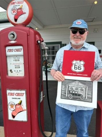 PSC Hat and Barry S, holding a litho print he created for a historic RT 66 Texaco gas station in Dwight IL  