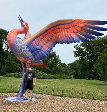PSC Logo Is about to get “raptured up” by a Raptor at Morton Arboretum. Ted R saves the day