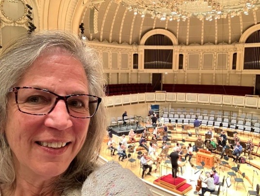 PSC Business Card and Nancy McG at an open rehearsal for the Chicago Symphony Orchestra Orchestra Hall