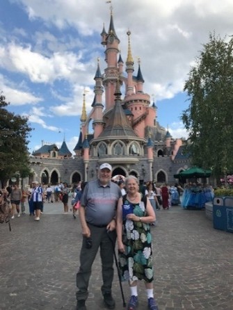 PSC Neck Wallet in front of Disney Paris Cinderella Castle with Barry & Cheryl S