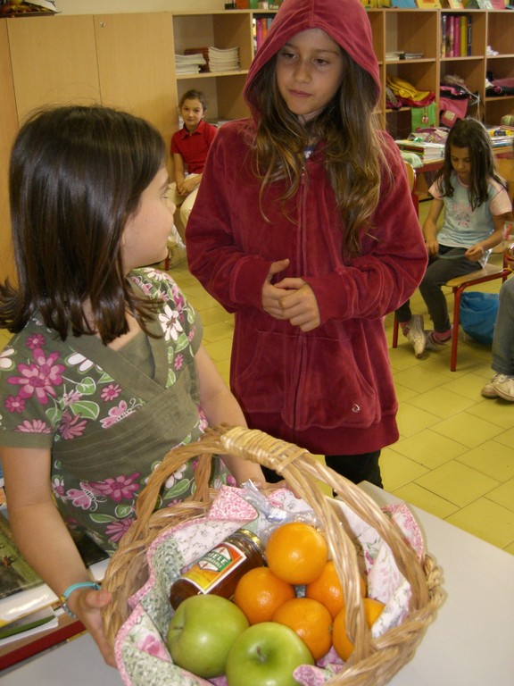 Please Little Red take this basket to Grandma, she likes apples, oranges, honey and biscuits.