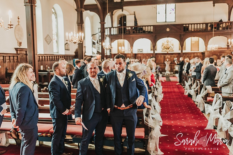 groom looking nervous in church